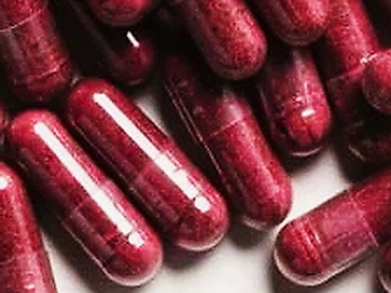 Beet root powder pills closeup