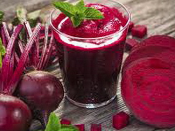 Red beet roots juiced in glass