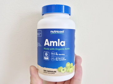 Jim Dillan holding Nutricost Amla bottle